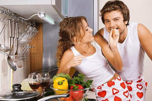 A woman feeds a man product for potency